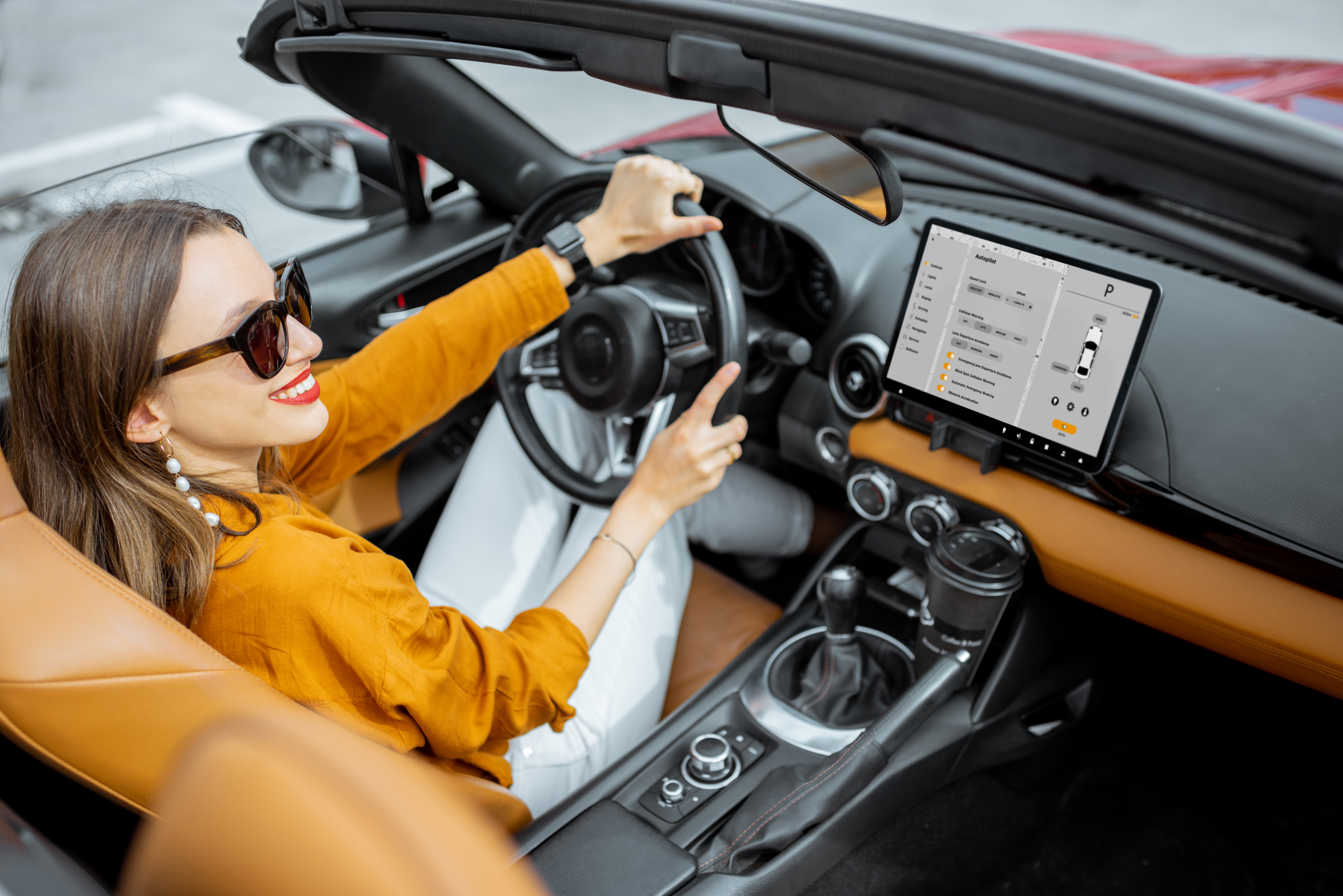 woman-driving-sports-car-with-a-digital-touchscree-2023-11-27-04-49-06-utc